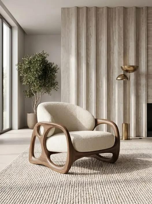 A curved bouclé armchair in daylight